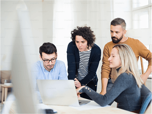 Employees looking at a computer