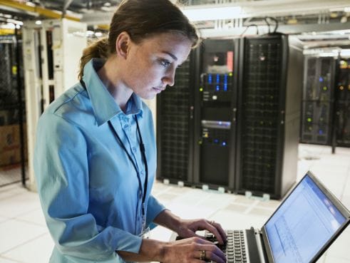 A Netpower colleague preparing a laptop for a user